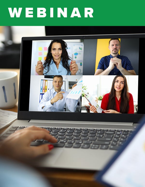 An open laptop displaying four videos from a video call.